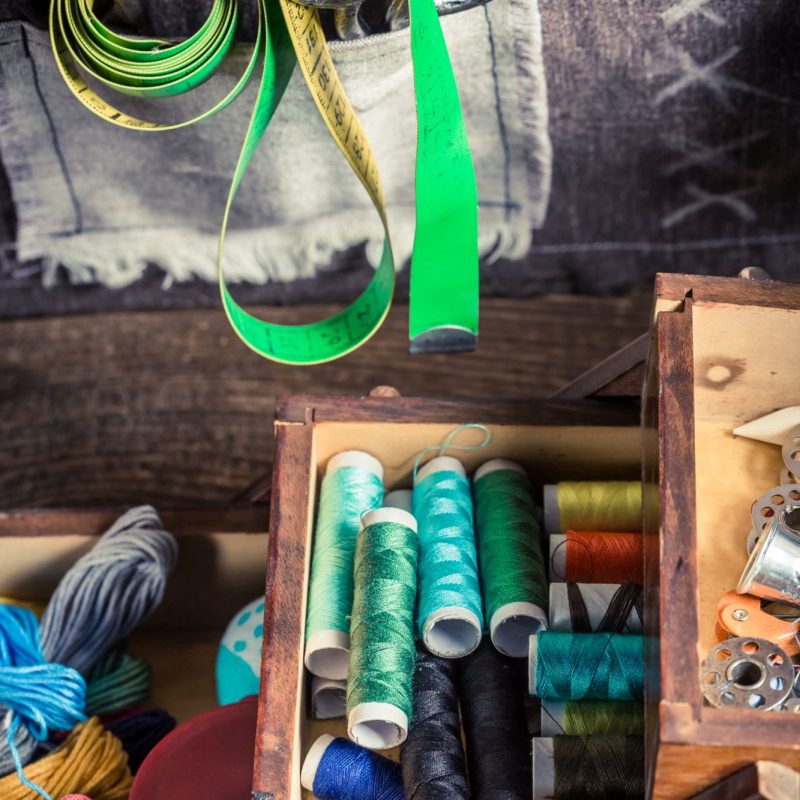 Tailor’s wooden box with needles, threads and buttons Tailor's wooden box with needles, threads and buttons